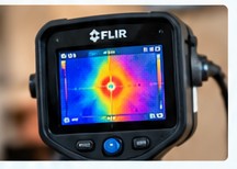Thermal camera showing a localized hot spot beneath flooring.